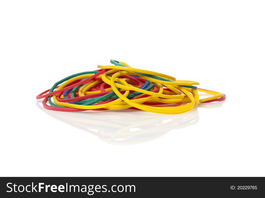 Colorful rubber bands against a white background