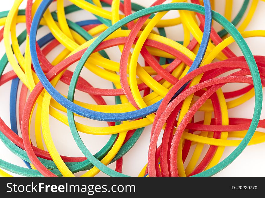 Colorful rubber bands against a white background