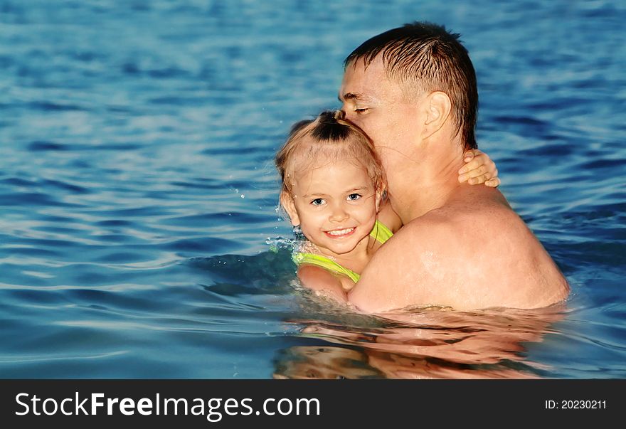 Color photo of father and daughter swimming in the sea. Color photo of father and daughter swimming in the sea