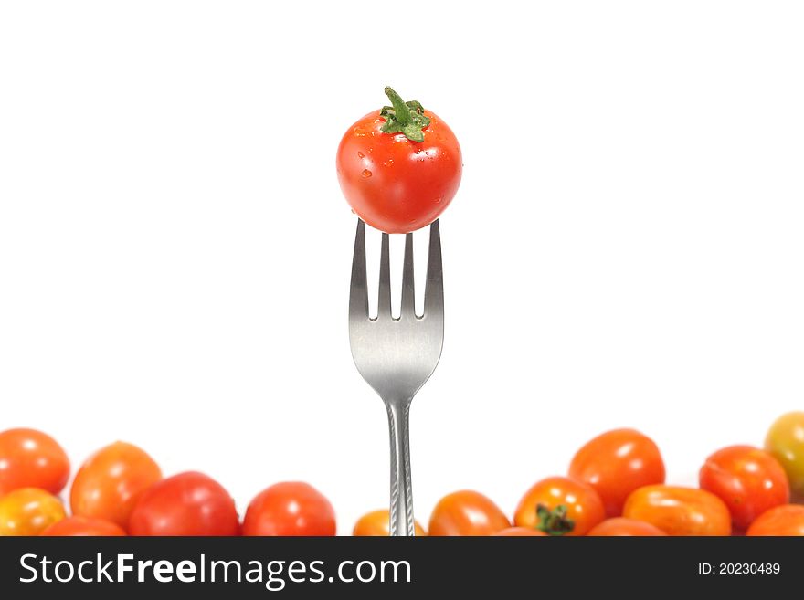 The fresh tomatoes isolated on white background