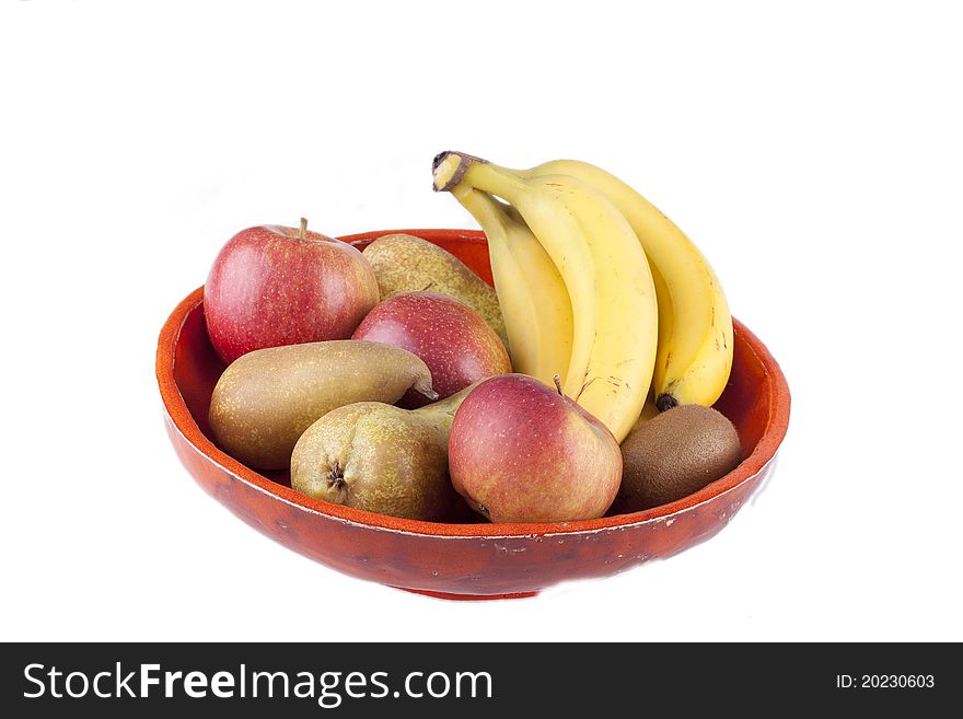 Studio-shot of a handmade fruit bowl with various fruits inside, isolated on white.