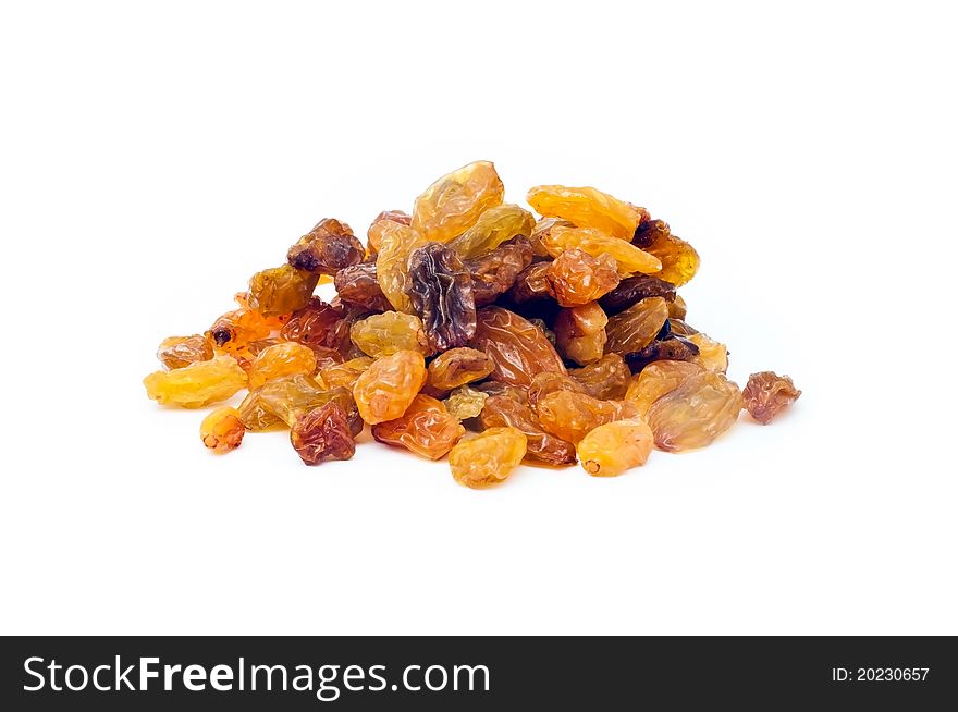 Close up shot of a pile of raisins on a white background