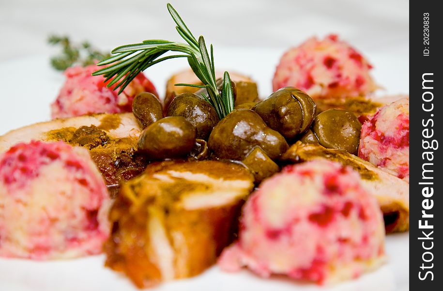 Close-up of pork fillet dish garnished with home made nougat ice cream