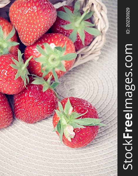 Heap of fresh strawberries in a basket, closeup shot