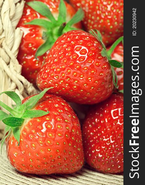 Fresh strawberries in a basket, closeup shot