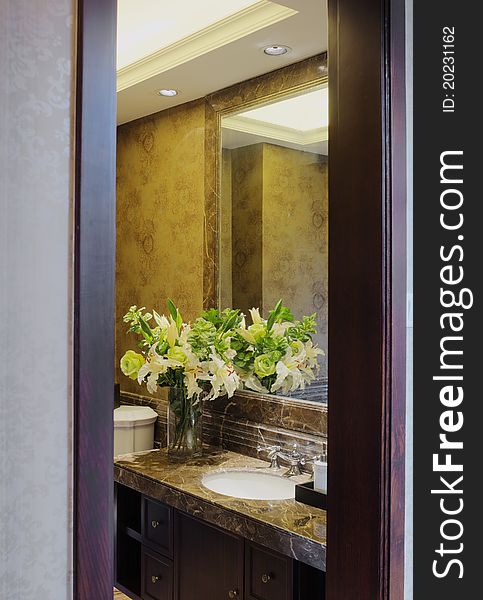 Watch a elegant bathroom through door frame