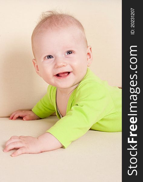 Baby lying on sofa