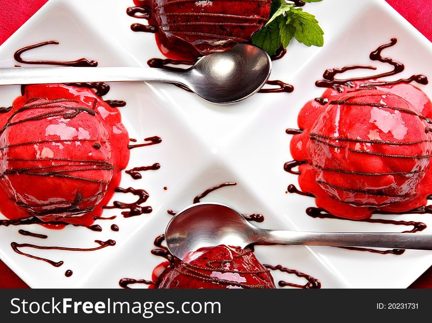 Berry fruit ice cream served on the white plate