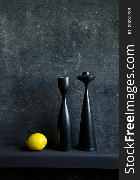 Black still-life with one yellow lemon. Black still-life with one yellow lemon