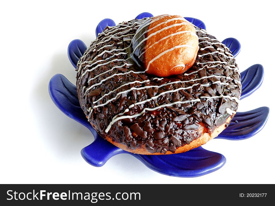 Morning Donut on Blue Leafy Plate on White Table