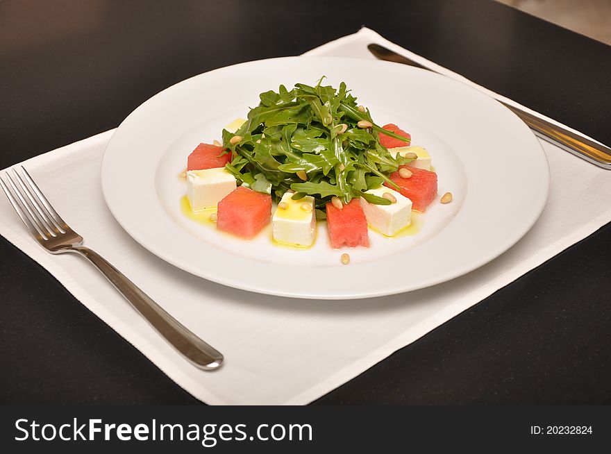 Sweet salad with watermelon and cheese. Angle view.