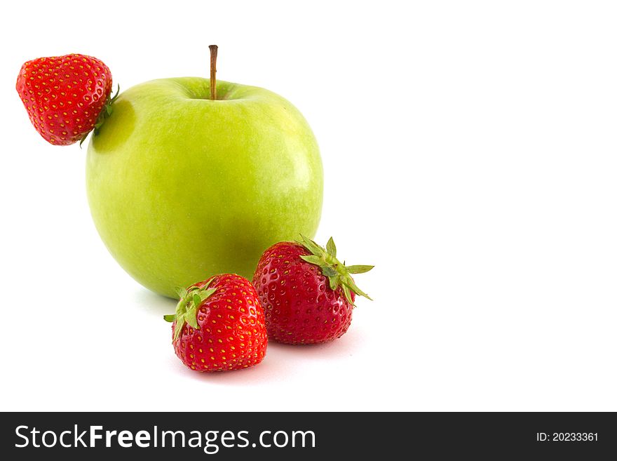 Green apple and three red strawberries isolated on white background. Green apple and three red strawberries isolated on white background
