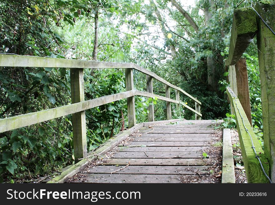 Small wooden footbridge in a rural location. Small wooden footbridge in a rural location