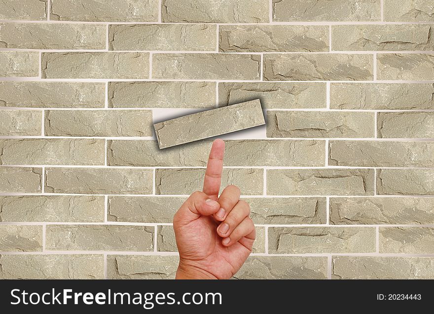 Hand Pointing On Brick Wall