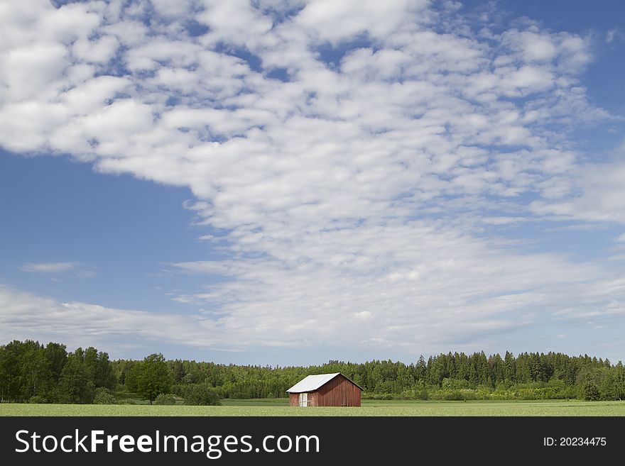 Barn in field and sky with clouds. Barn in field and sky with clouds