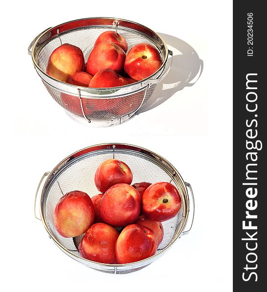 Nectarine fruit rinsed withing a strainer. Nectarine fruit rinsed withing a strainer