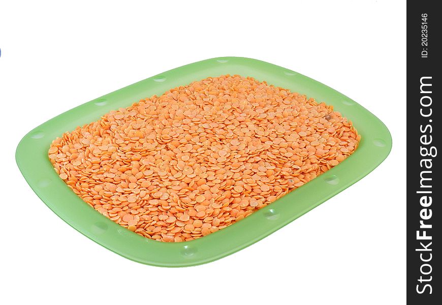 Lentils on a plate on a white background