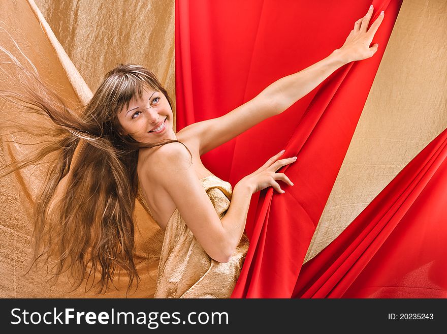 A beautiful young girl dressed in a red cloth. A beautiful young girl dressed in a red cloth