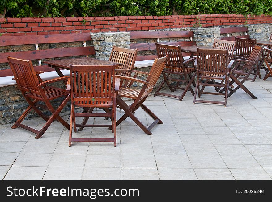 Wooden chairs and tables in the  resort.