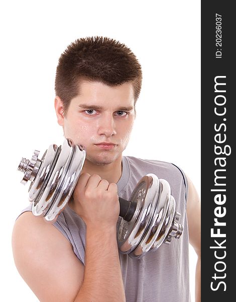 Young man exercising with a dumbbell. Young man exercising with a dumbbell