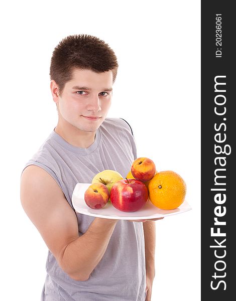 Young healthy man hold fruits. Young healthy man hold fruits
