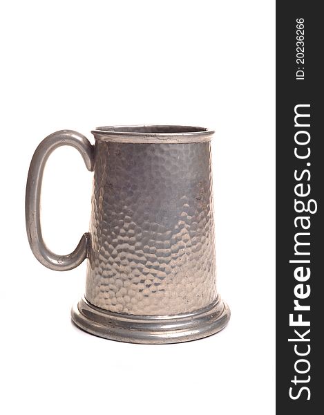 Photograph of a pewter tankard shot in studio against a white background
