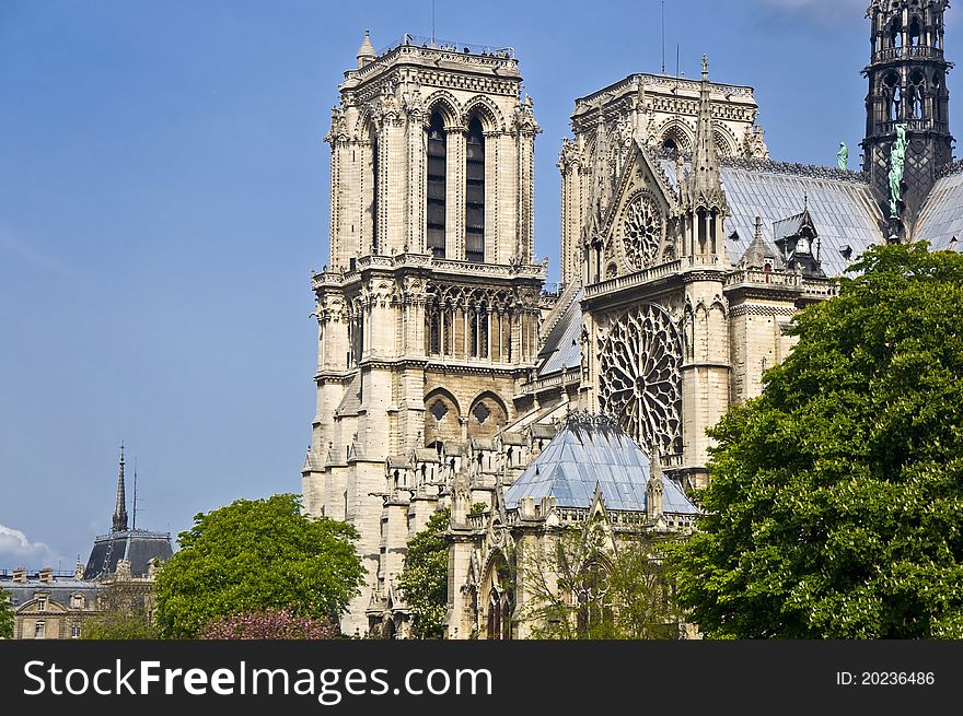 Notre Dame de Paris. A fragment of the towers against the blue clear sky. Paris, France.