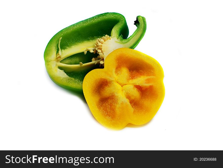 Cut green and yellow sweet peppers isolated