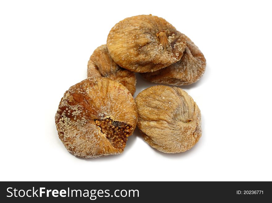 A few dry sweet figs isolated on white