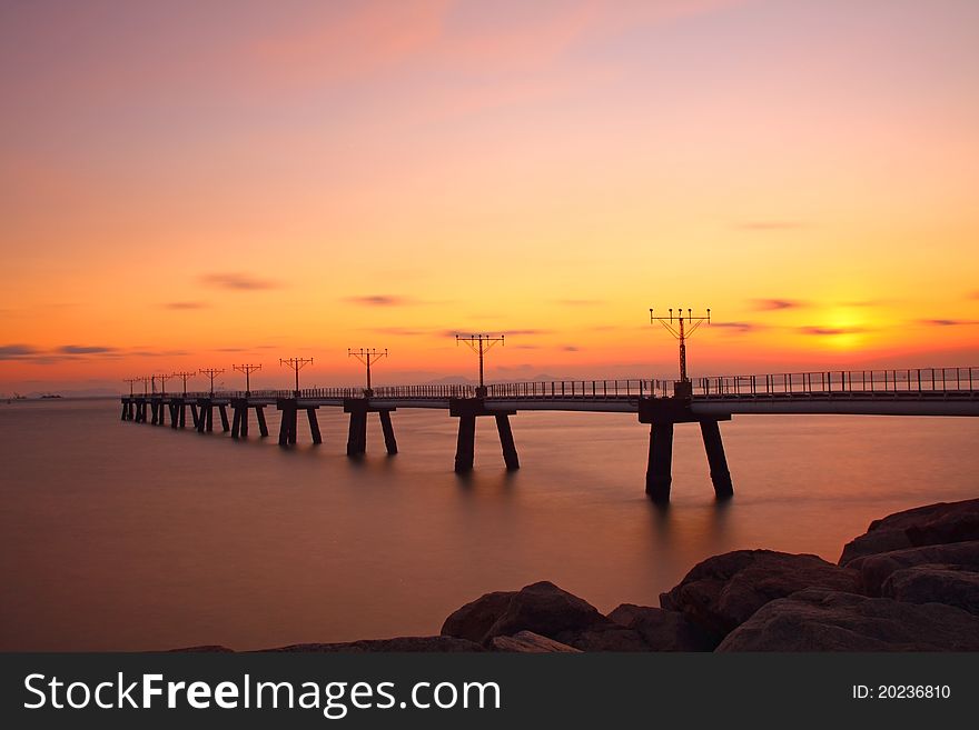 Sunset at coast of the sea