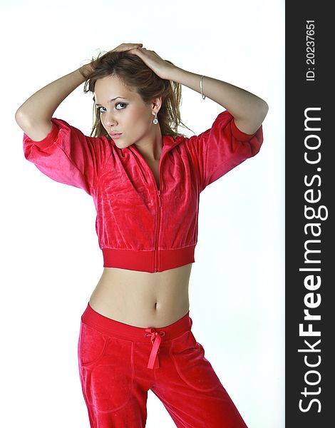 Slender,seductive girl in a red suit. Slender,seductive girl in a red suit