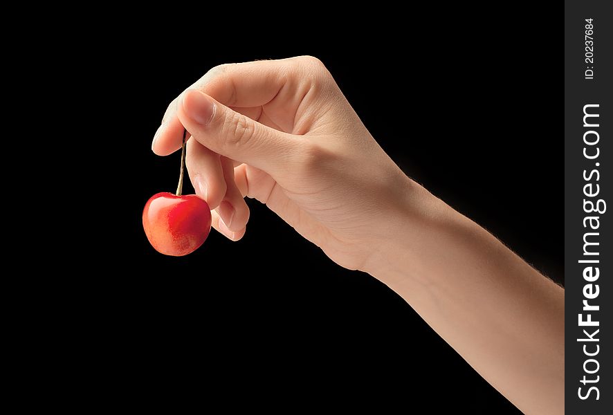 One Sweet Cherries On A Hand.