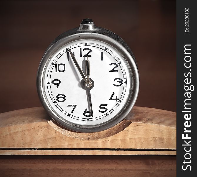 Dirty old table clock close up