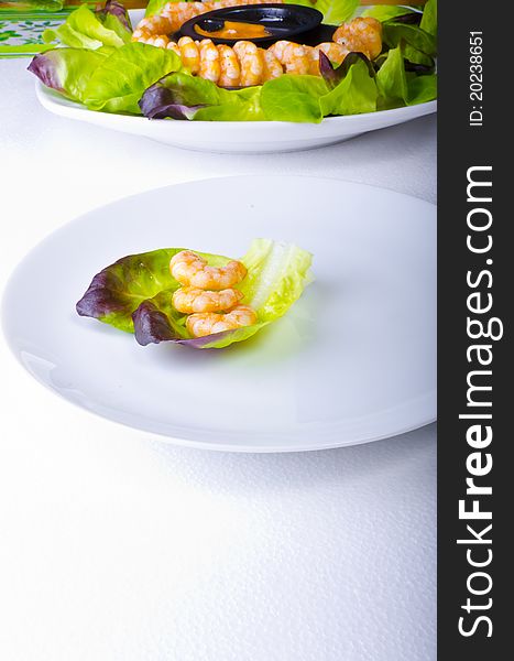 Fresh shrimps with green salad and different sauces. Fresh shrimps with green salad and different sauces