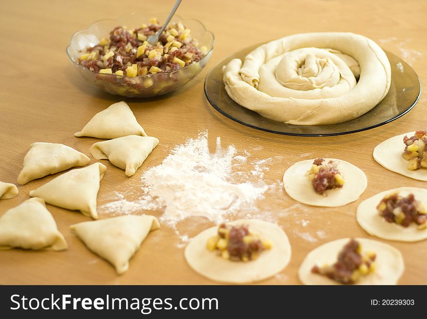 Dough with minced meat patties cooking Asian samsa