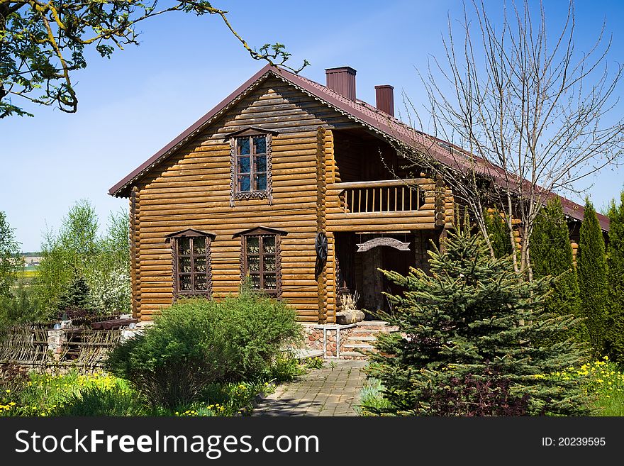 The house constructed of the present logs located in countryside. The house constructed of the present logs located in countryside