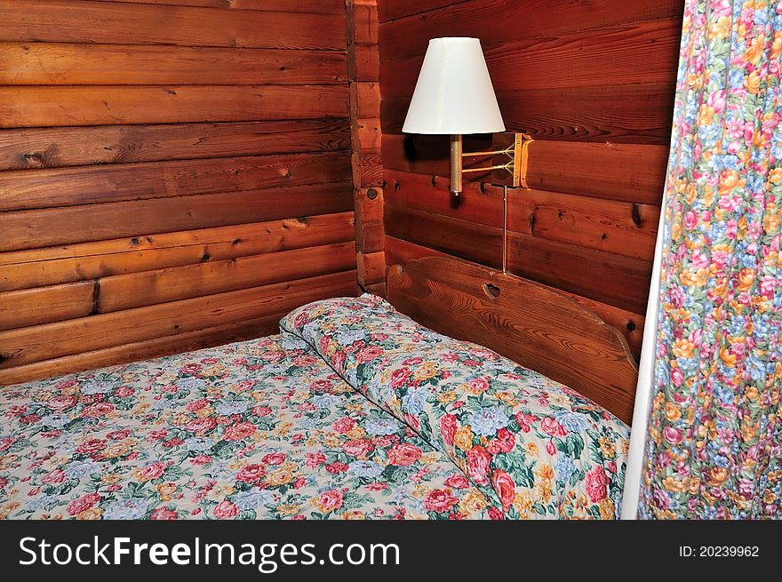 Comfortable wood textured hotel room with unique interior design.