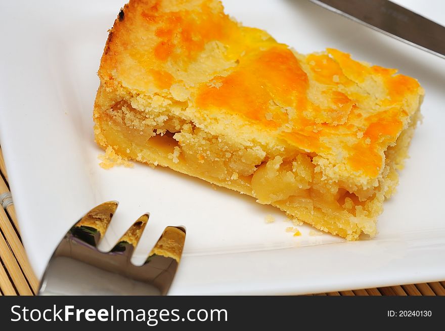 Single slice of sumptuous tart with golden crust. Single slice of sumptuous tart with golden crust.
