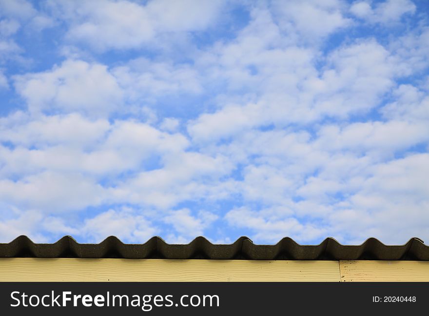 A deep blue sky with fluffy white clouds