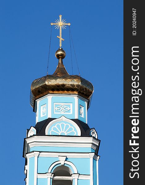 Golden dome of the Orthodox Church against the blue sky. Golden dome of the Orthodox Church against the blue sky