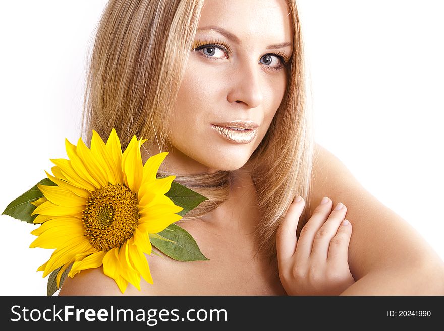 Portrait of young beautiful blond girl with stylish make-up and sunflower. Portrait of young beautiful blond girl with stylish make-up and sunflower