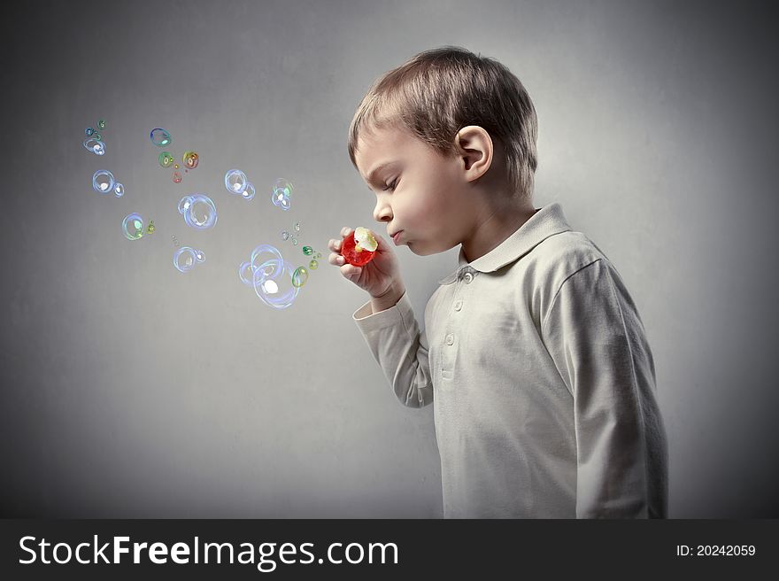 Child playing with soap bubbles