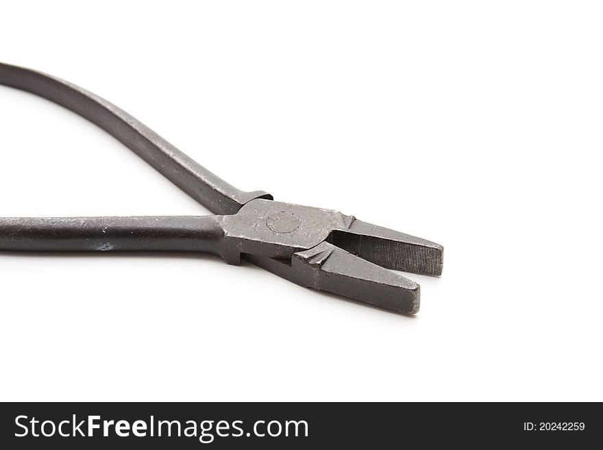 Old rusty pliers onto white background