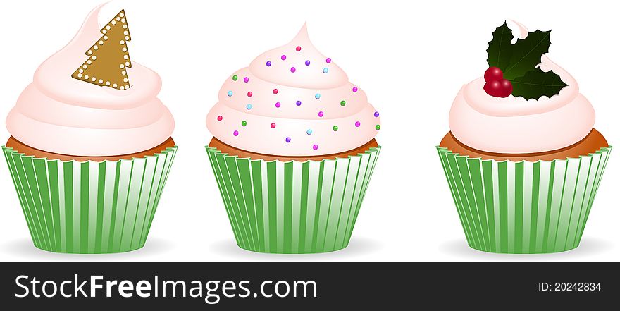 Set of three cupcakes with green wrappers and christmas decorations. Set of three cupcakes with green wrappers and christmas decorations
