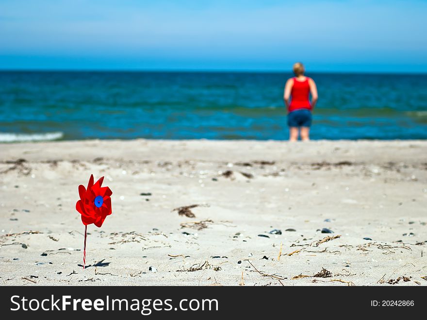 Red Wind Turbine On The Beach