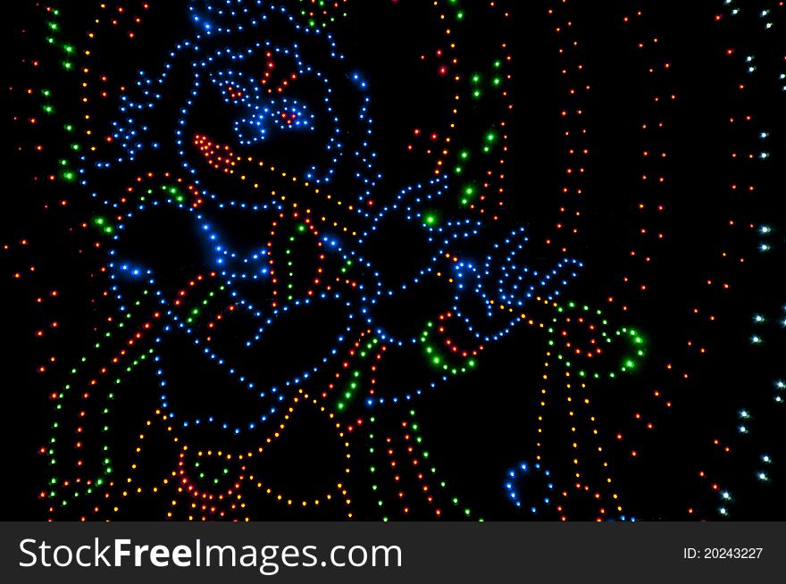An outine of the Hindu God Lord Krishna made by hundreds of tiny bulbs running on electricity. An outine of the Hindu God Lord Krishna made by hundreds of tiny bulbs running on electricity.