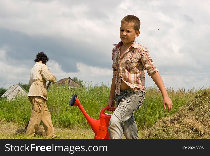 The Boy And Watering Can