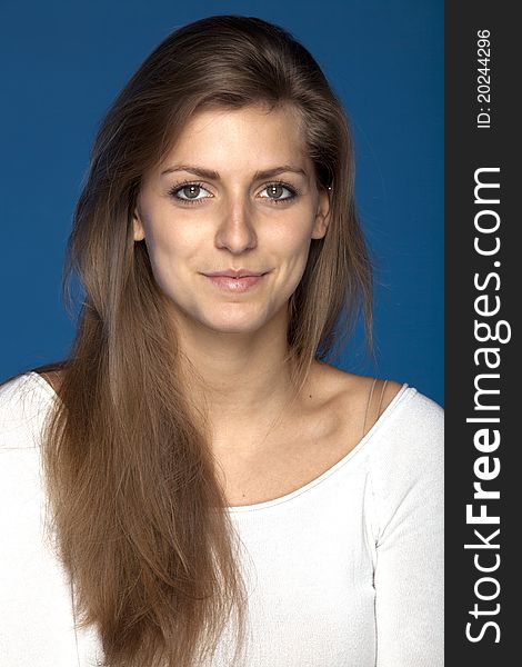 Close-up portrait of young female looking at the camera