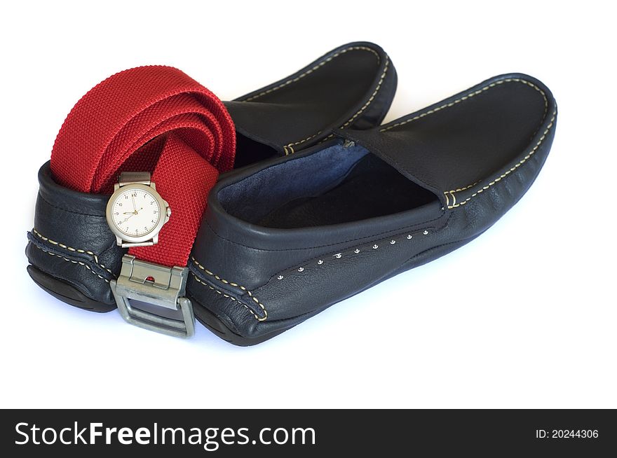 Leather navy mocassins with red textile belt and round silver watch isolated on a white background. Leather navy mocassins with red textile belt and round silver watch isolated on a white background