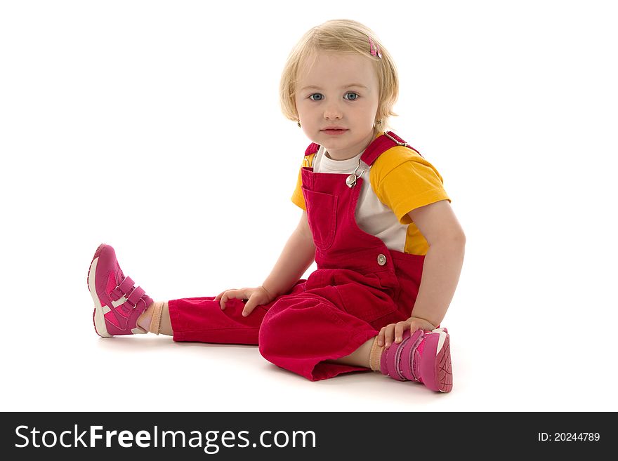 Beautiful girl sits, on white background.